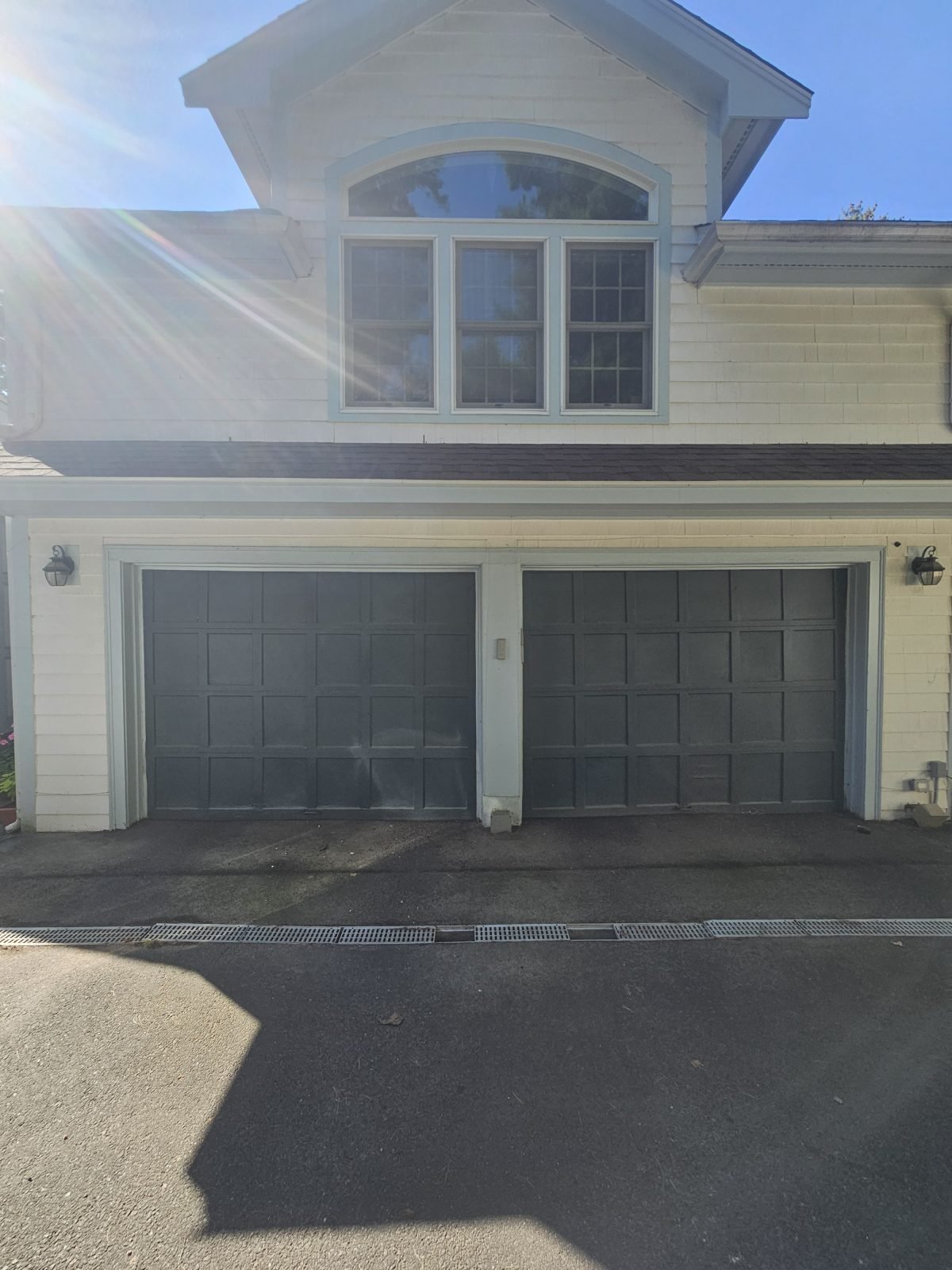 Old garage doors before replacement in Belmont, MA