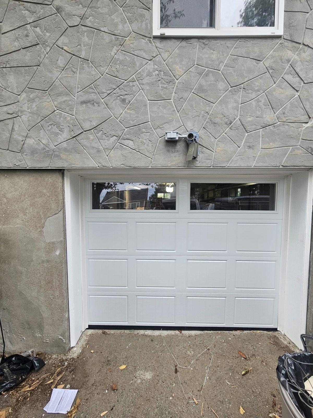 New white garage door with windows installed in Waltham, MA