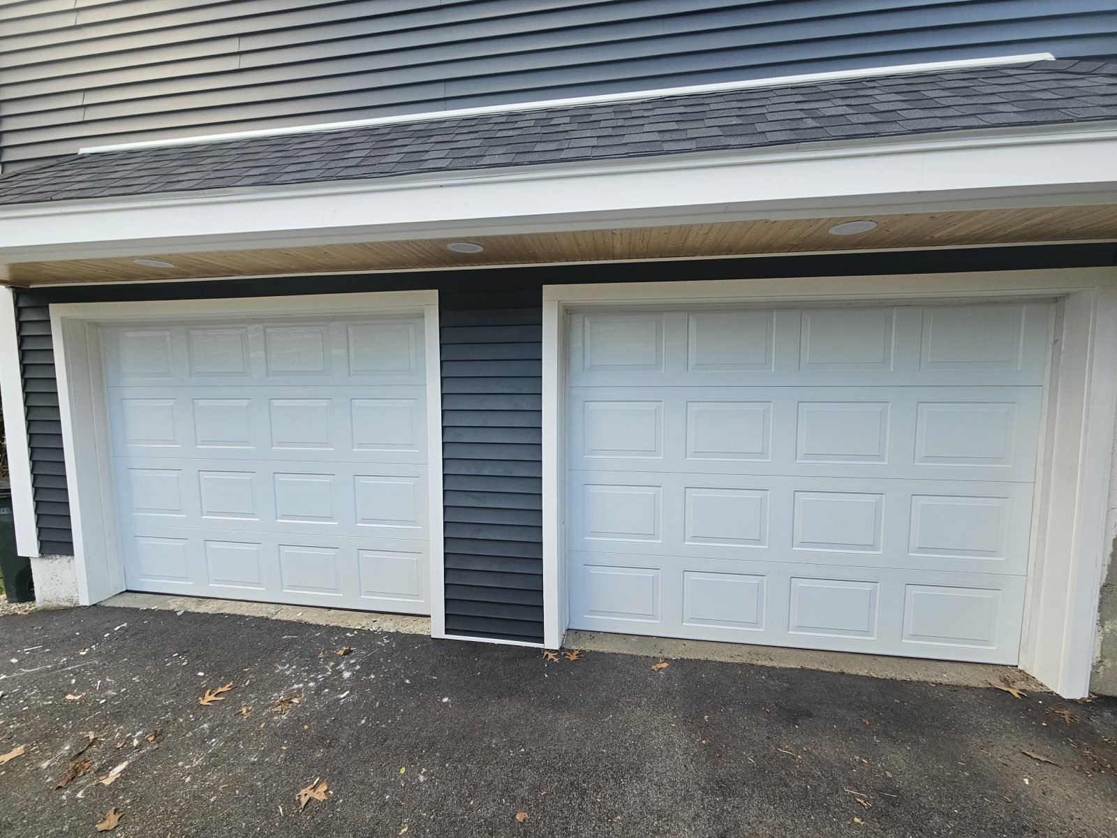 New white raised-panel garage door installed
